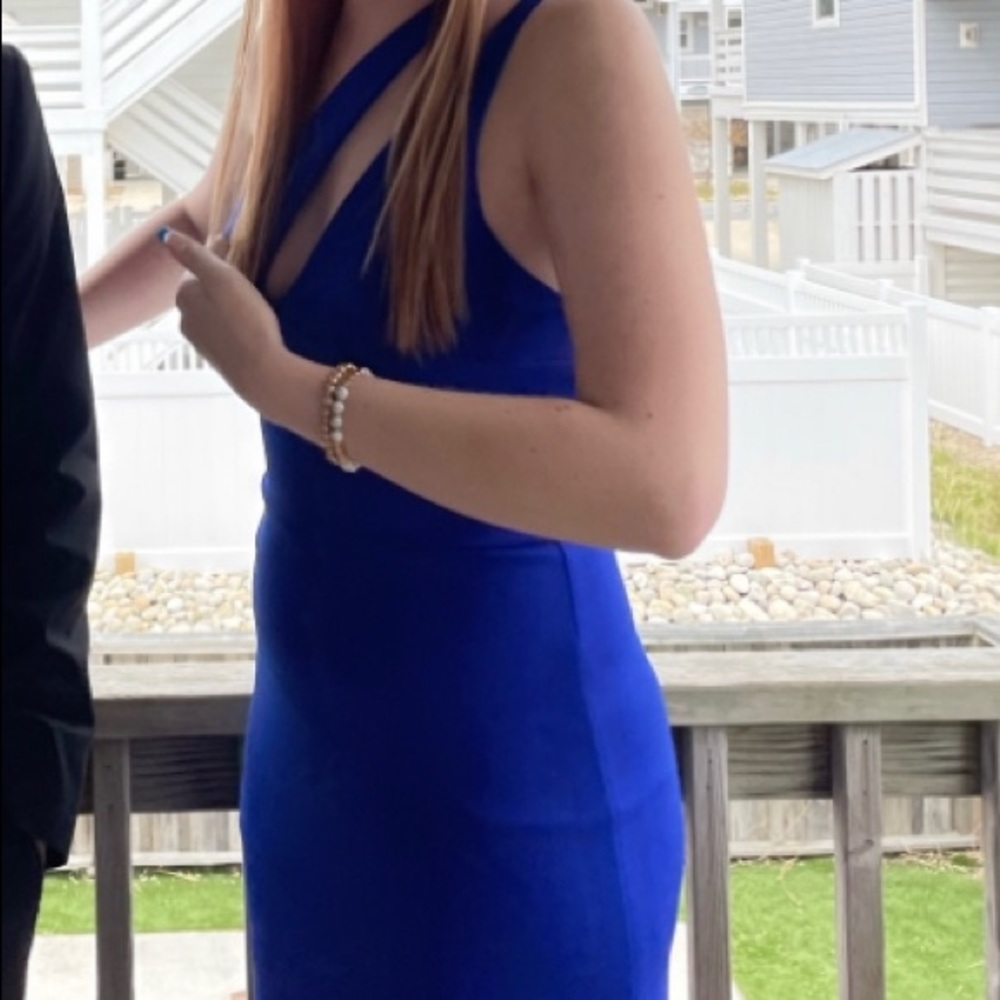 Full length dress with slit. Worn once for 2 hours. Bright blue. One shoulder